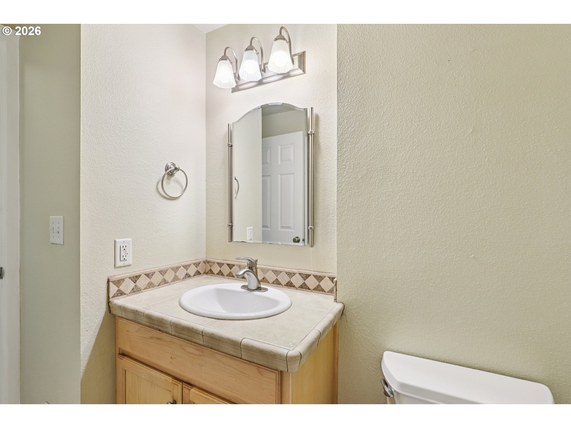 2680 Southwest 87th Avenue, Unit 5 Portland, OR 97225 - Photo 15 of 25 a bathroom with a sink and a mirror