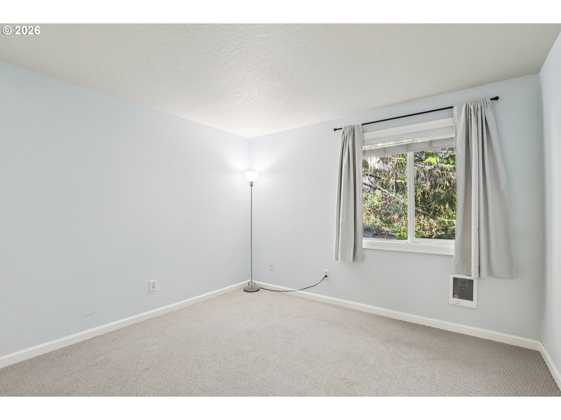 2680 Southwest 87th Avenue, Unit 5 Portland, OR 97225 - Photo 16 of 25 a view of an empty room with a window