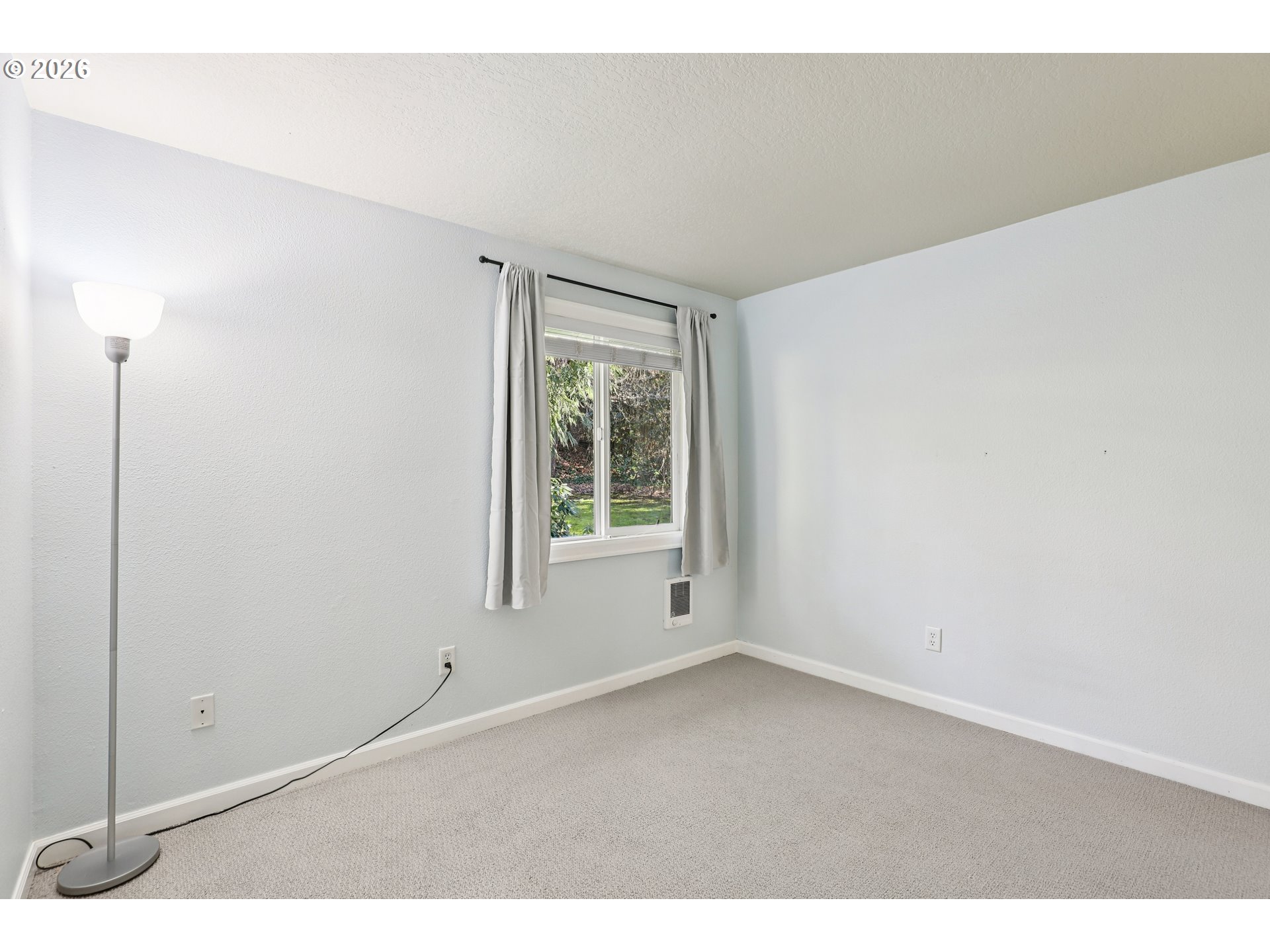2680 Southwest 87th Avenue, Unit 5 Portland, OR 97225 - Photo 17 of 25 a view of an empty room with a window