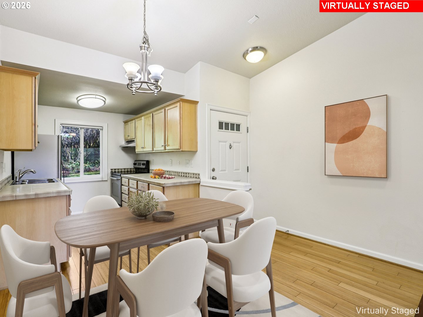 2680 Southwest 87th Avenue, Unit 5 Portland, OR 97225 - Photo 5 of 25 a view of a dining room with furniture and wooden floor