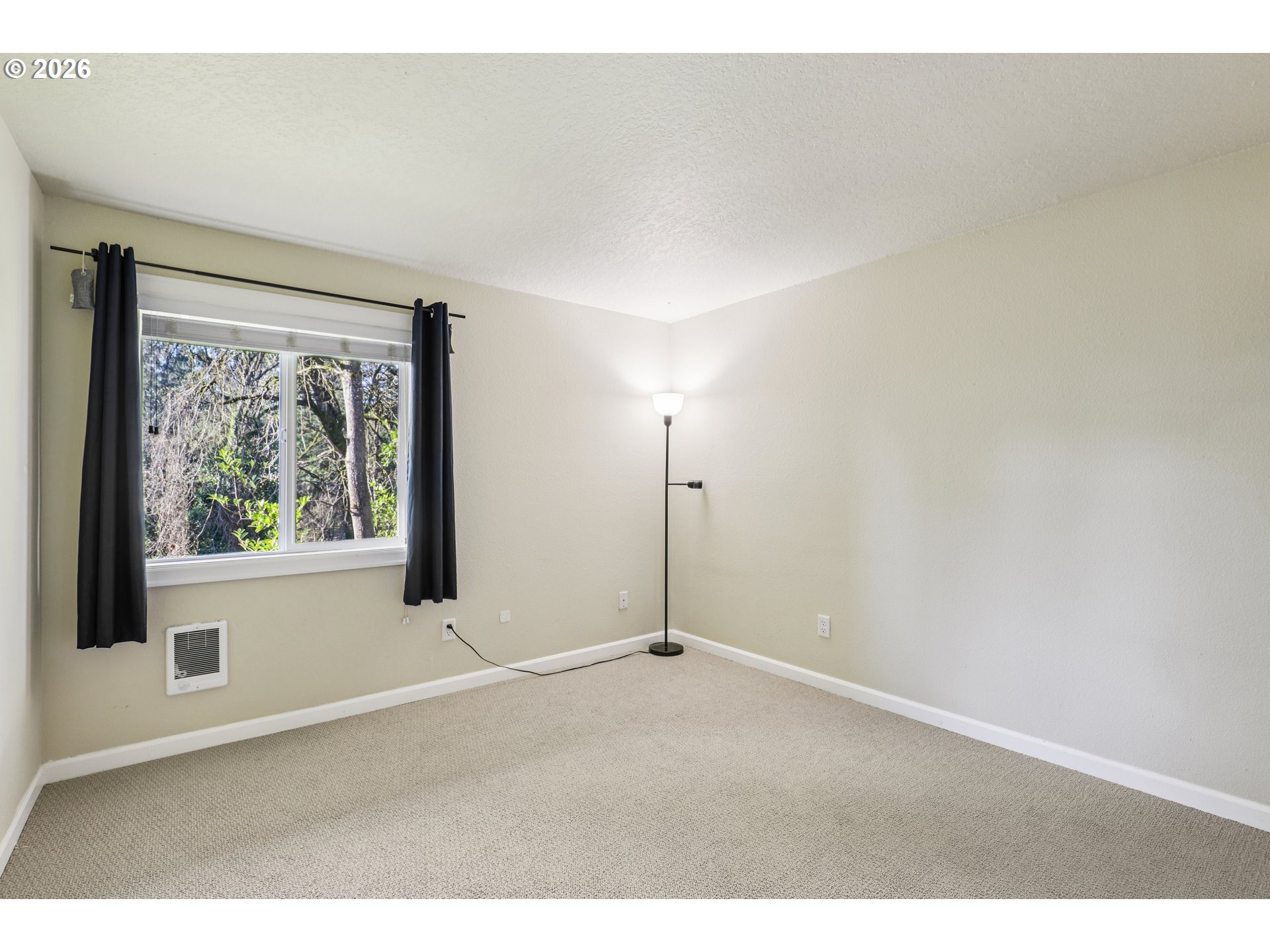 2680 Southwest 87th Avenue, Unit 5 Portland, OR 97225 - Photo 9 of 25 a view of an empty room with a window