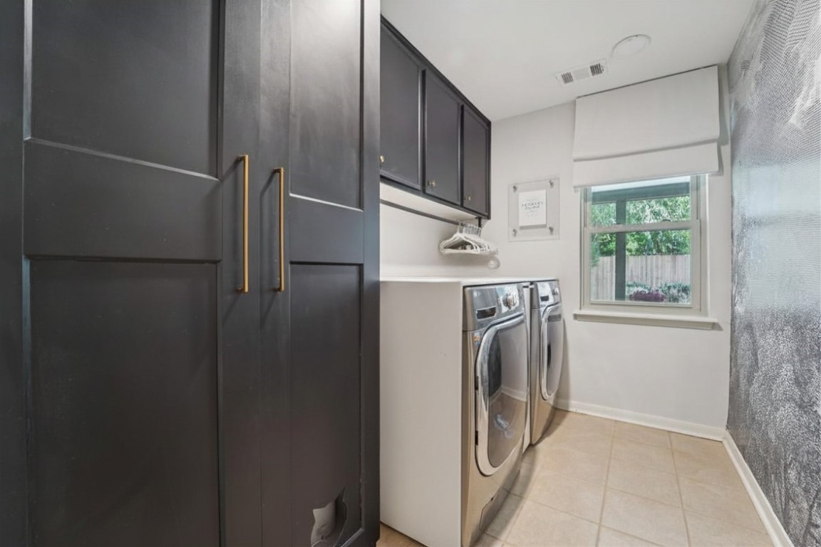 8307 Ash Valley Drive Spring, TX 77379 - Photo 34 of 48 Laundry room overlooking back patio with custom countertop and plenty of storage