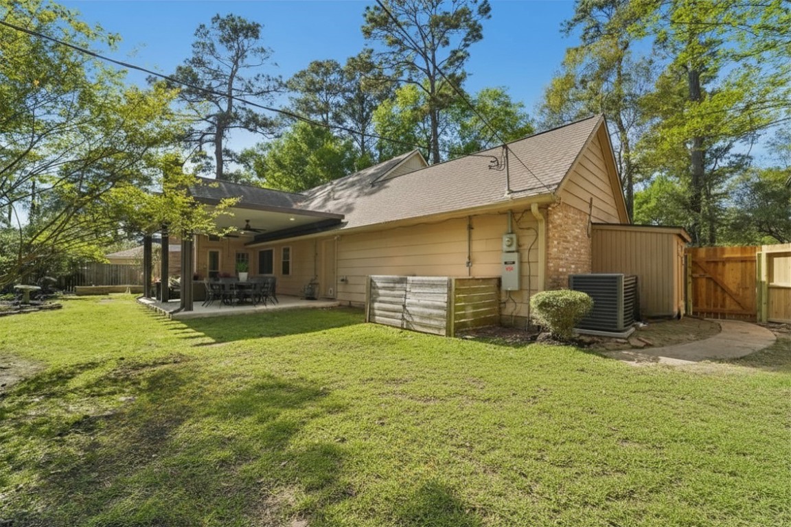 8307 Ash Valley Drive Spring, TX 77379 - Photo 36 of 48 Whole home generator added in 2024. Backyard features new sod, large shed and 3 garden beds.