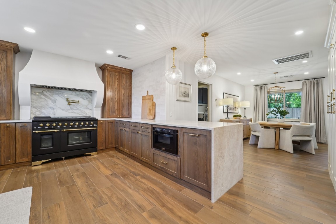 8307 Ash Valley Drive Spring, TX 77379 - Photo 4 of 48 Highly desired Taj Mahal quartzite countertops with dual waterfall edges