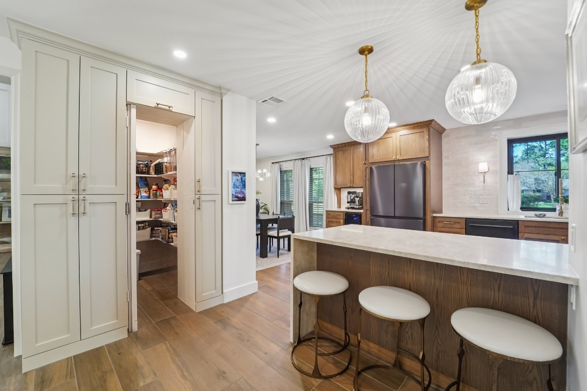 8307 Ash Valley Drive Spring, TX 77379 - Photo 9 of 48 Behind the door is a walk-in pantry