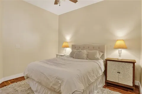 a bedroom with a bed and a night stand