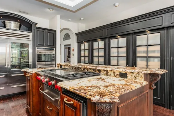 a dining table with chairs and window