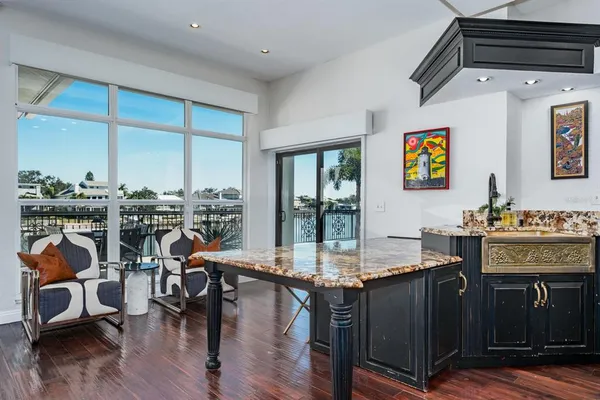 a kitchen with stainless steel appliances granite countertop a stove and cabinets