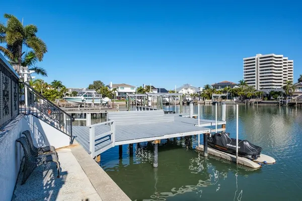 a view of residential houses with outdoor space and boats