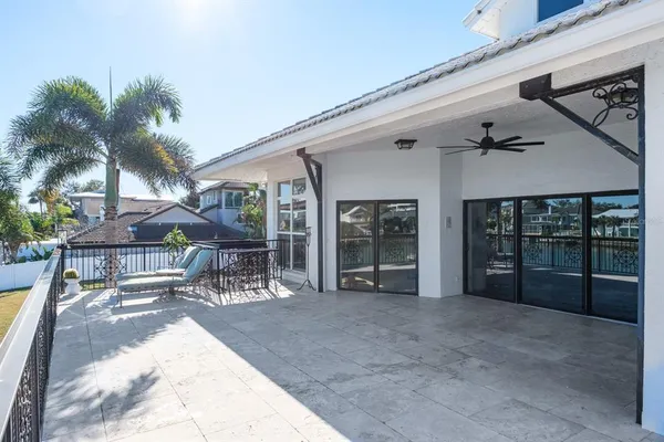 a view of a chairs with table in patio