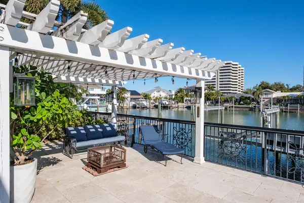 a view of a chairs and table in patio