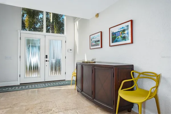 a view of a livingroom with furniture and a window