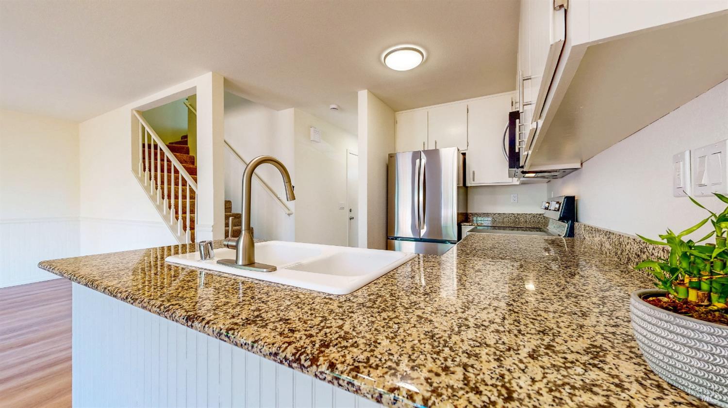 158 North Dutton Avenue Santa Rosa, CA 95401 - Photo 18 of 50 a kitchen with sink a refrigerator and microwave