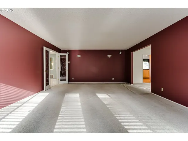 a view of a livingroom with a hall and window