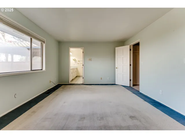a bathroom with a sink a toilet a mirror and shower