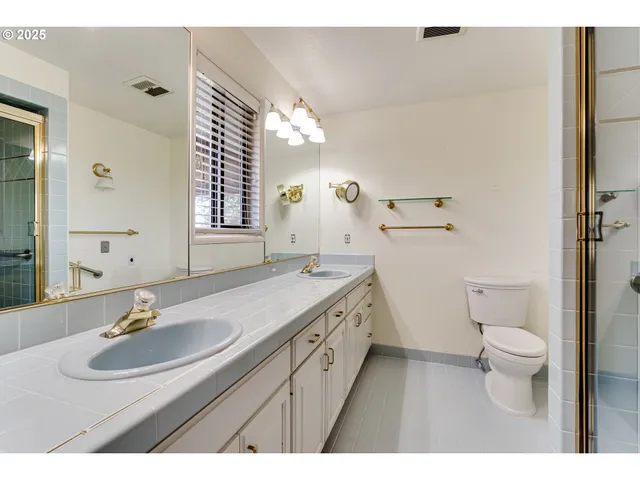 a bathroom with a sink a vanity and a mirror