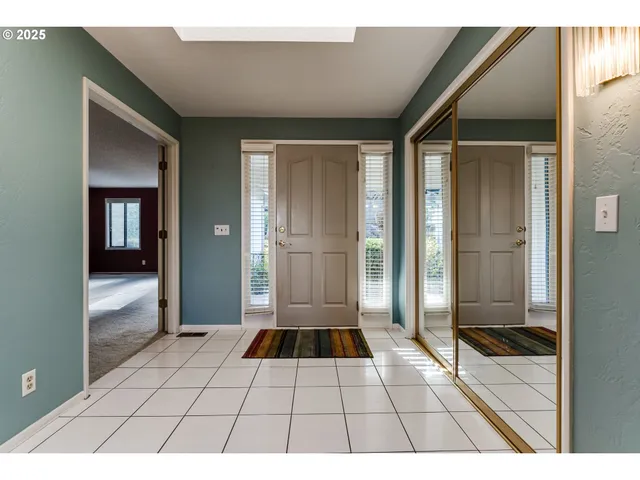 a bathroom with a glass door shower and a glass door
