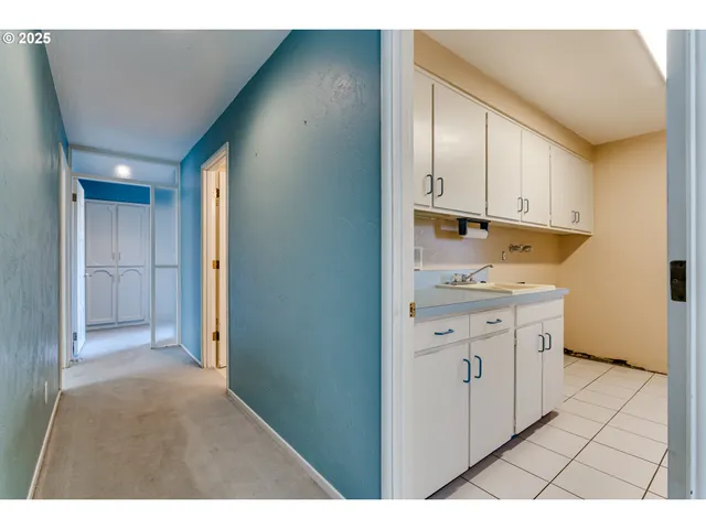 a view of empty room with a fireplace and window