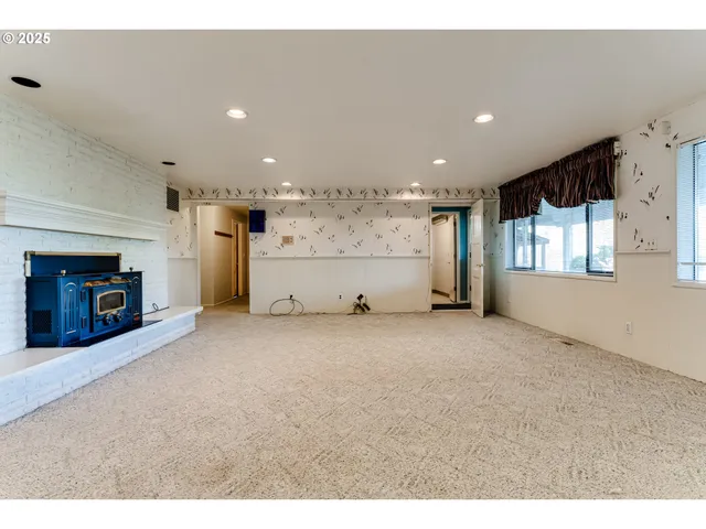 a view of a kitchen with a sink and cabinets