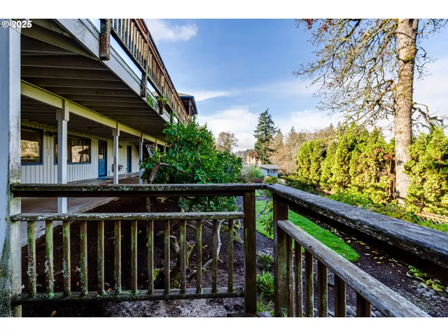 a view of hallway with wooden floor