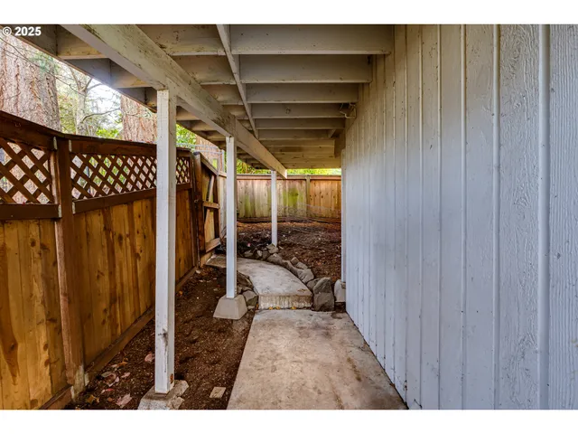 a view of an house with backyard space and garden