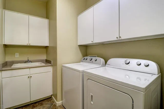 a utility room with dryer and washer