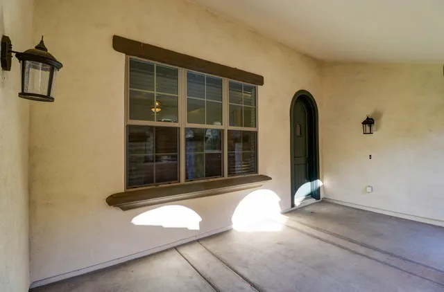a view of empty room with windows