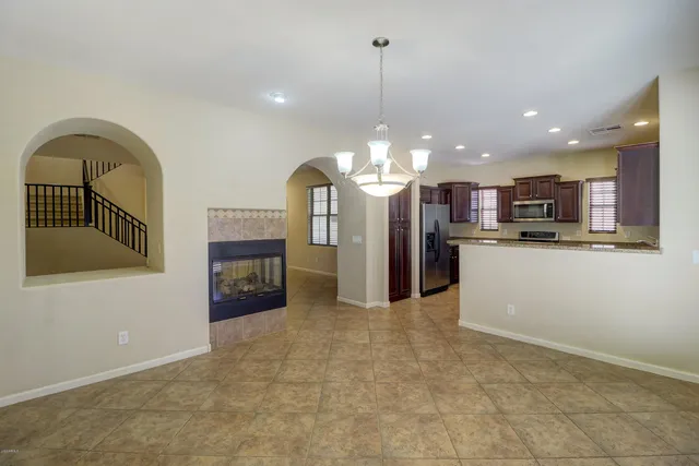 a view of a kitchen with a sink and an open kitchen view
