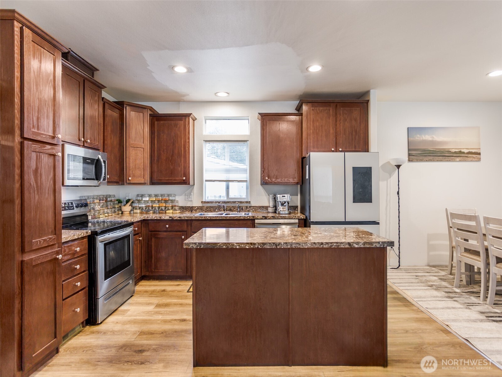 9430 Case Road Southwest, Unit 29 Olympia, WA 98512 - Photo 11 of 22 a large kitchen with stainless steel appliances granite countertop a stove a sink a refrigerator and a granite counter tops