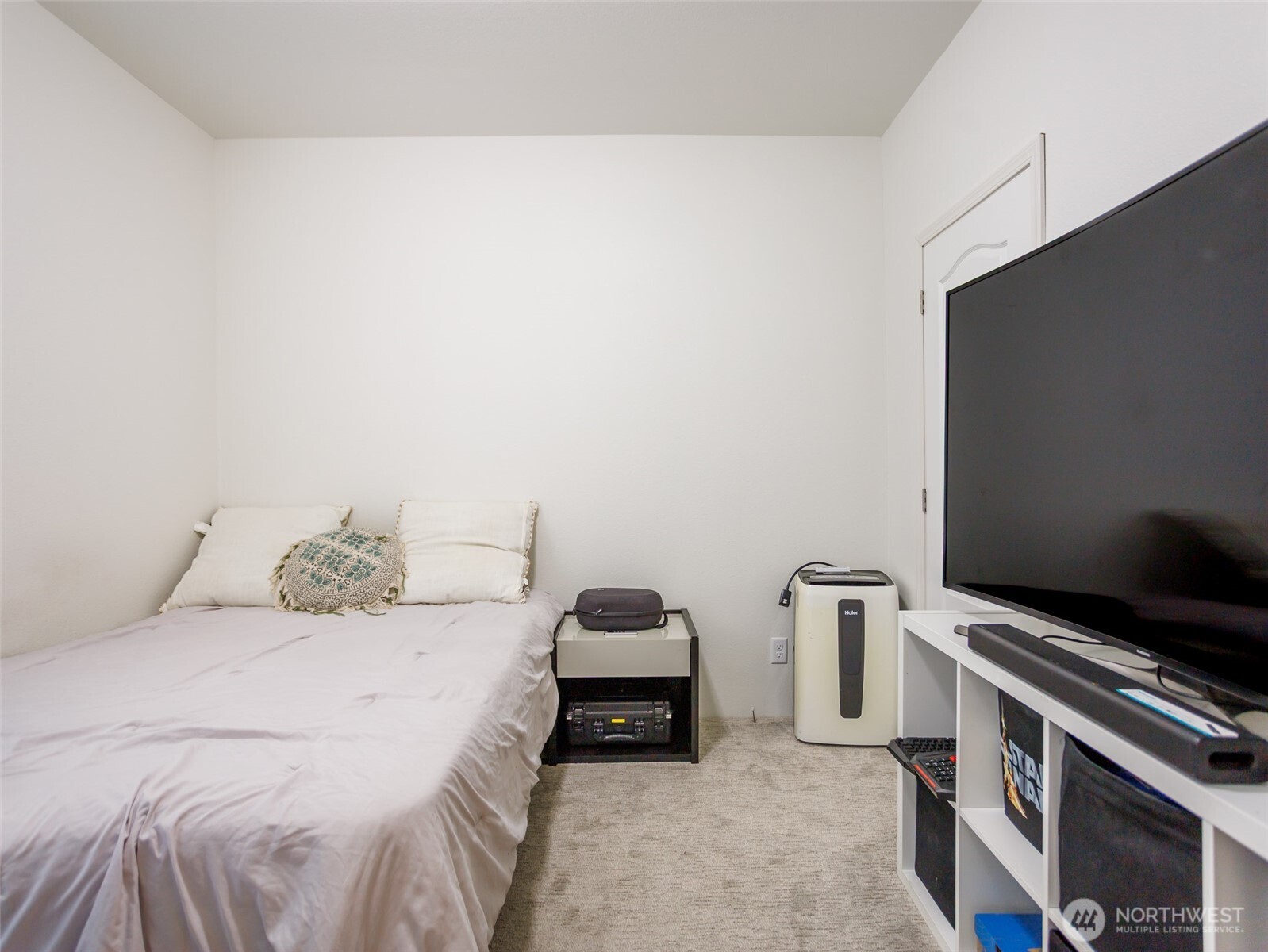 9430 Case Road Southwest, Unit 29 Olympia, WA 98512 - Photo 18 of 22 a bedroom with a bed and a television