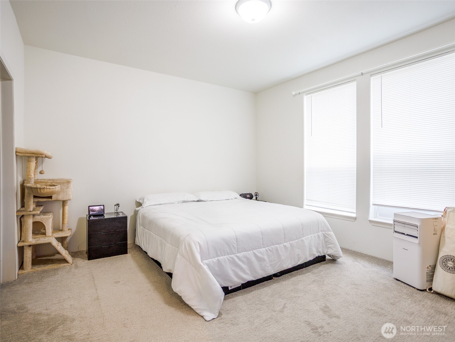 9430 Case Road Southwest, Unit 29 Olympia, WA 98512 - Photo 19 of 22 a bedroom with a bed and a window