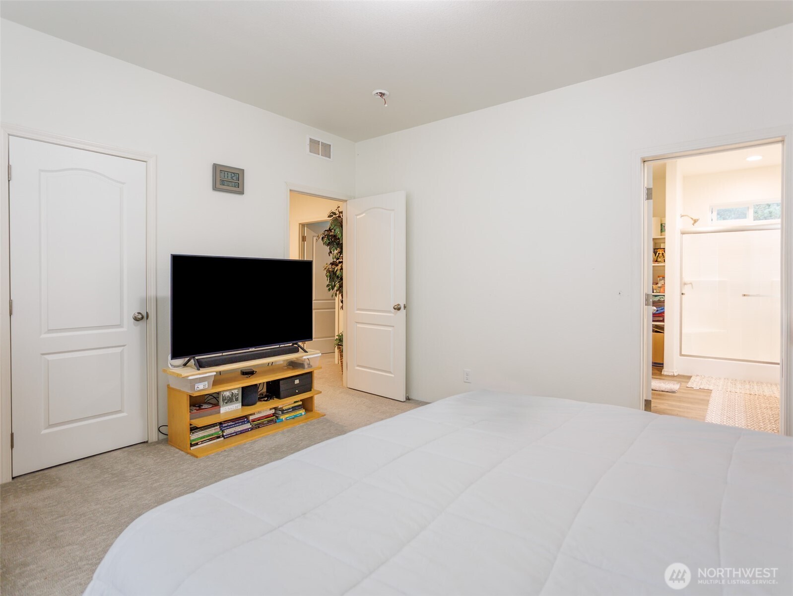 9430 Case Road Southwest, Unit 29 Olympia, WA 98512 - Photo 20 of 22 a bedroom with furniture and flat screen tv