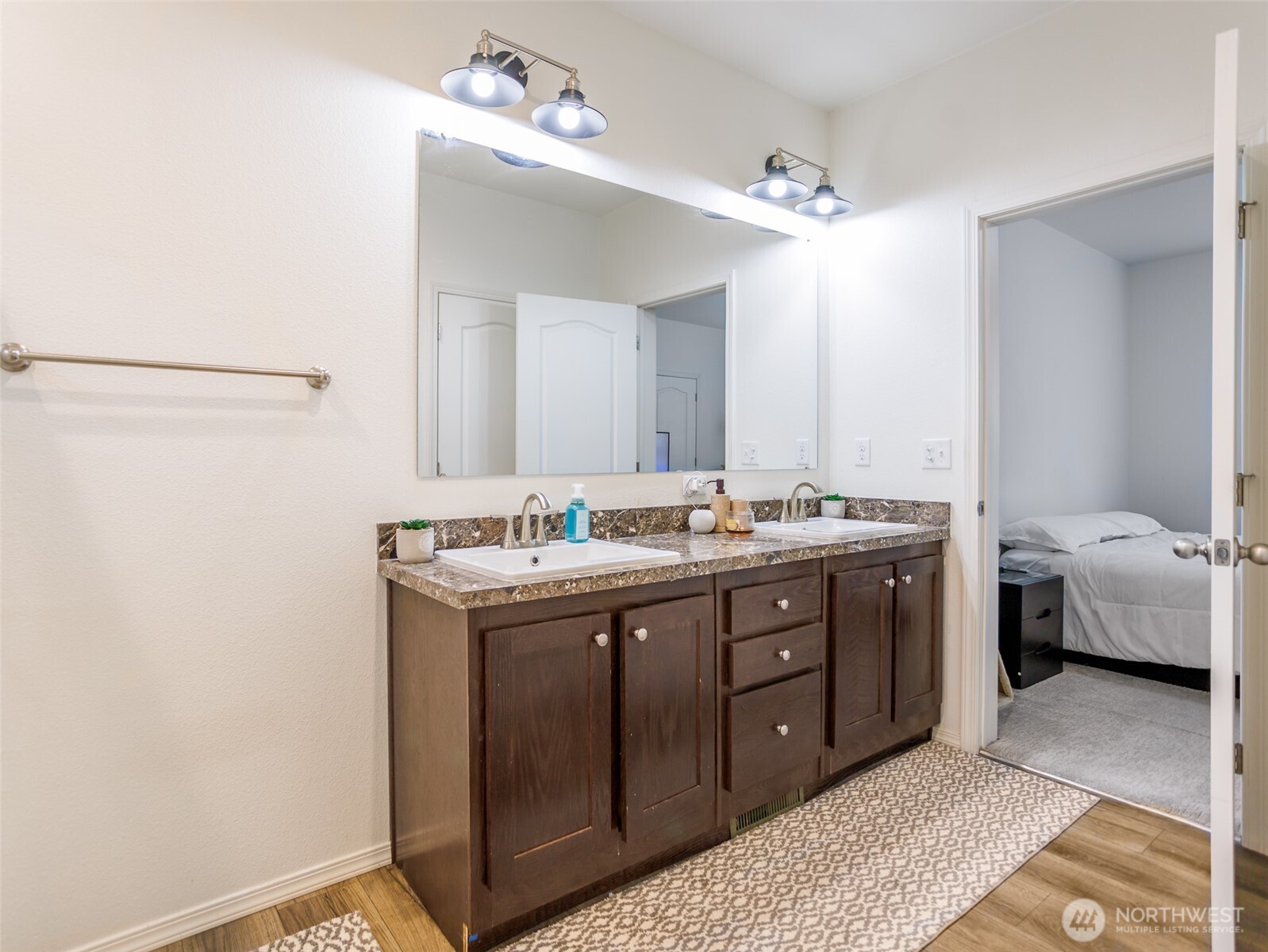 9430 Case Road Southwest, Unit 29 Olympia, WA 98512 - Photo 21 of 22 a spacious bathroom with a double vanity sink and a mirror