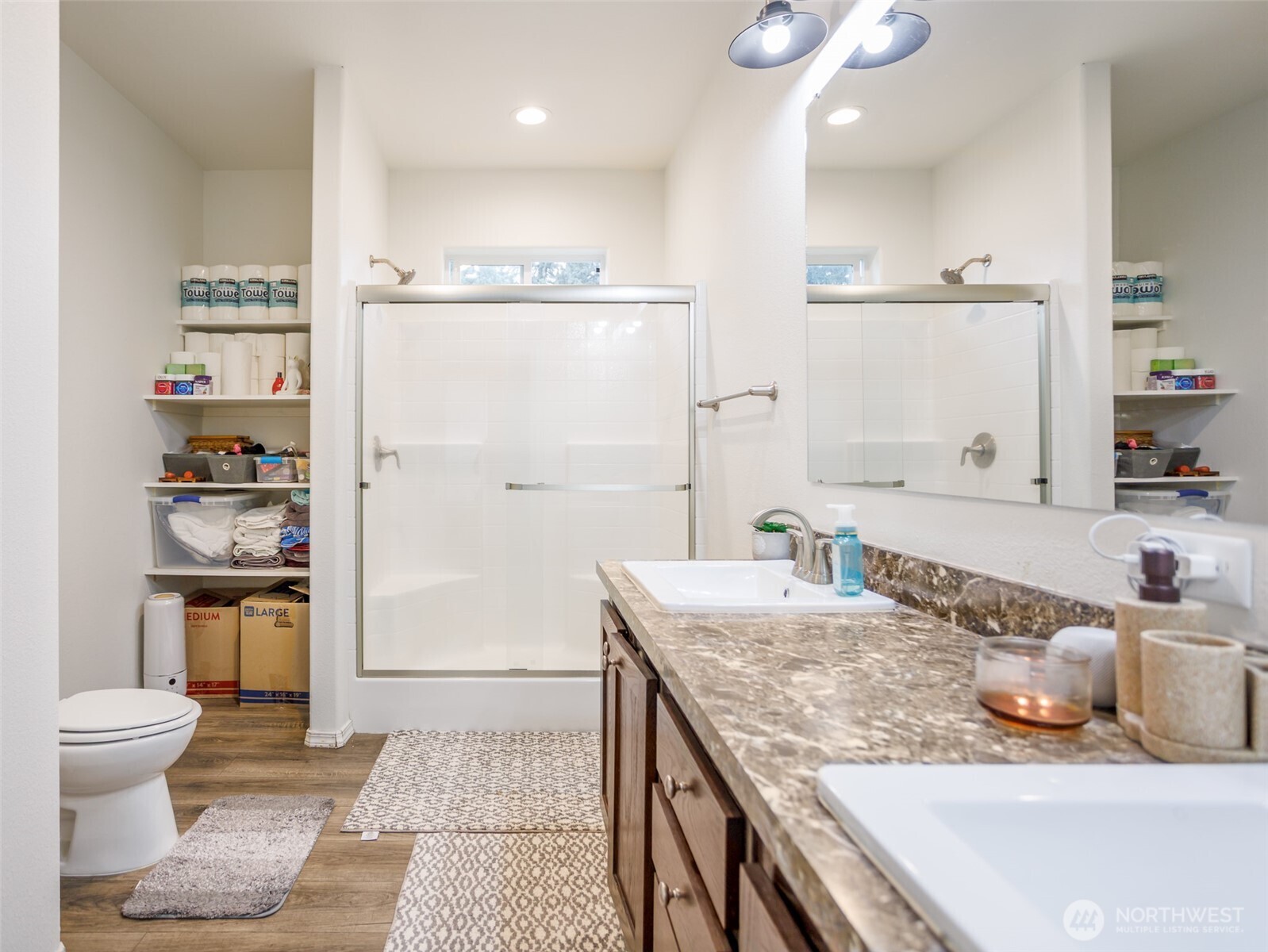 9430 Case Road Southwest, Unit 29 Olympia, WA 98512 - Photo 22 of 22 a bathroom with a granite countertop sink a toilet and a shower