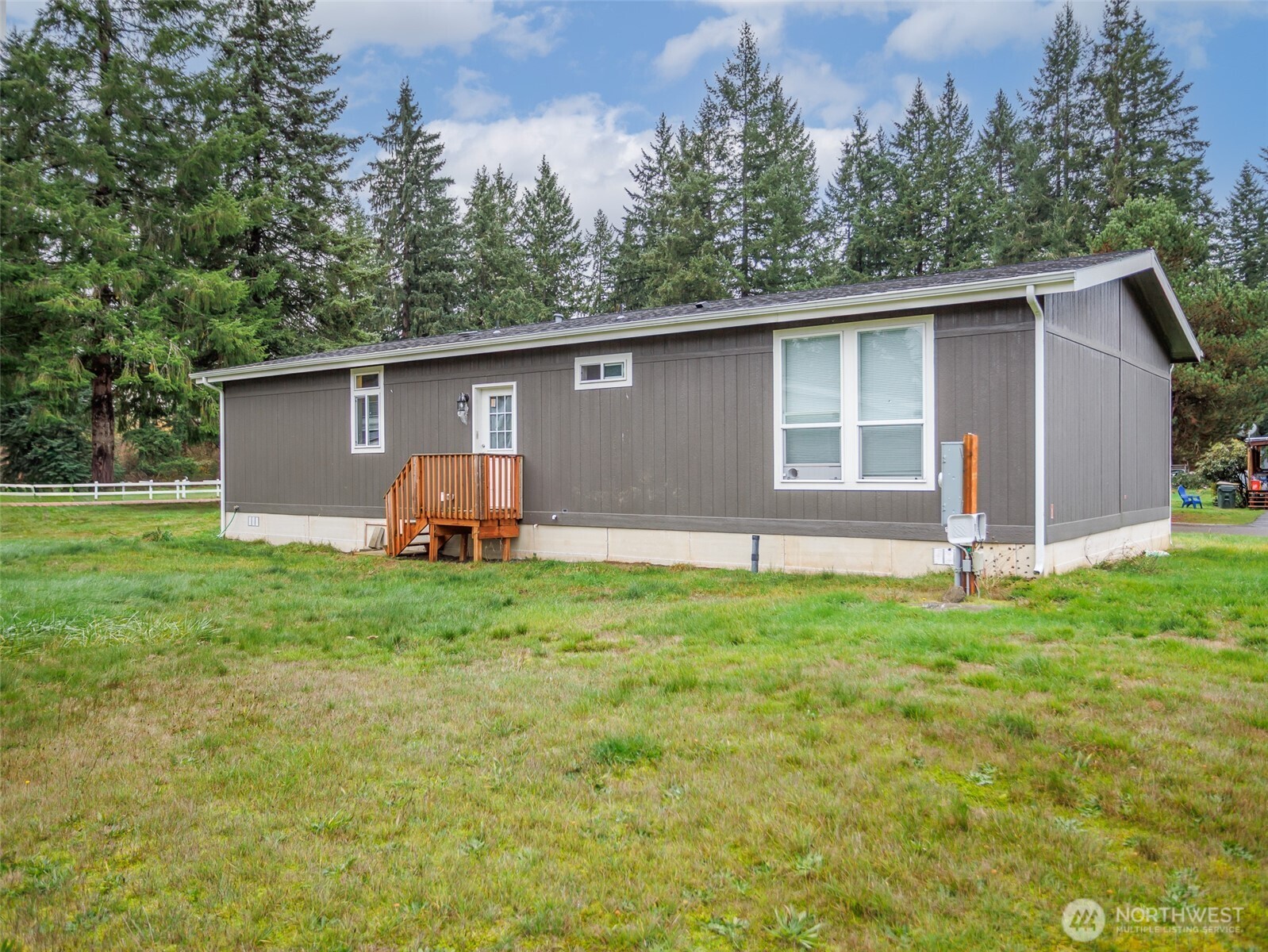 9430 Case Road Southwest, Unit 29 Olympia, WA 98512 - Photo 5 of 22 a backyard of a house with lots of green space