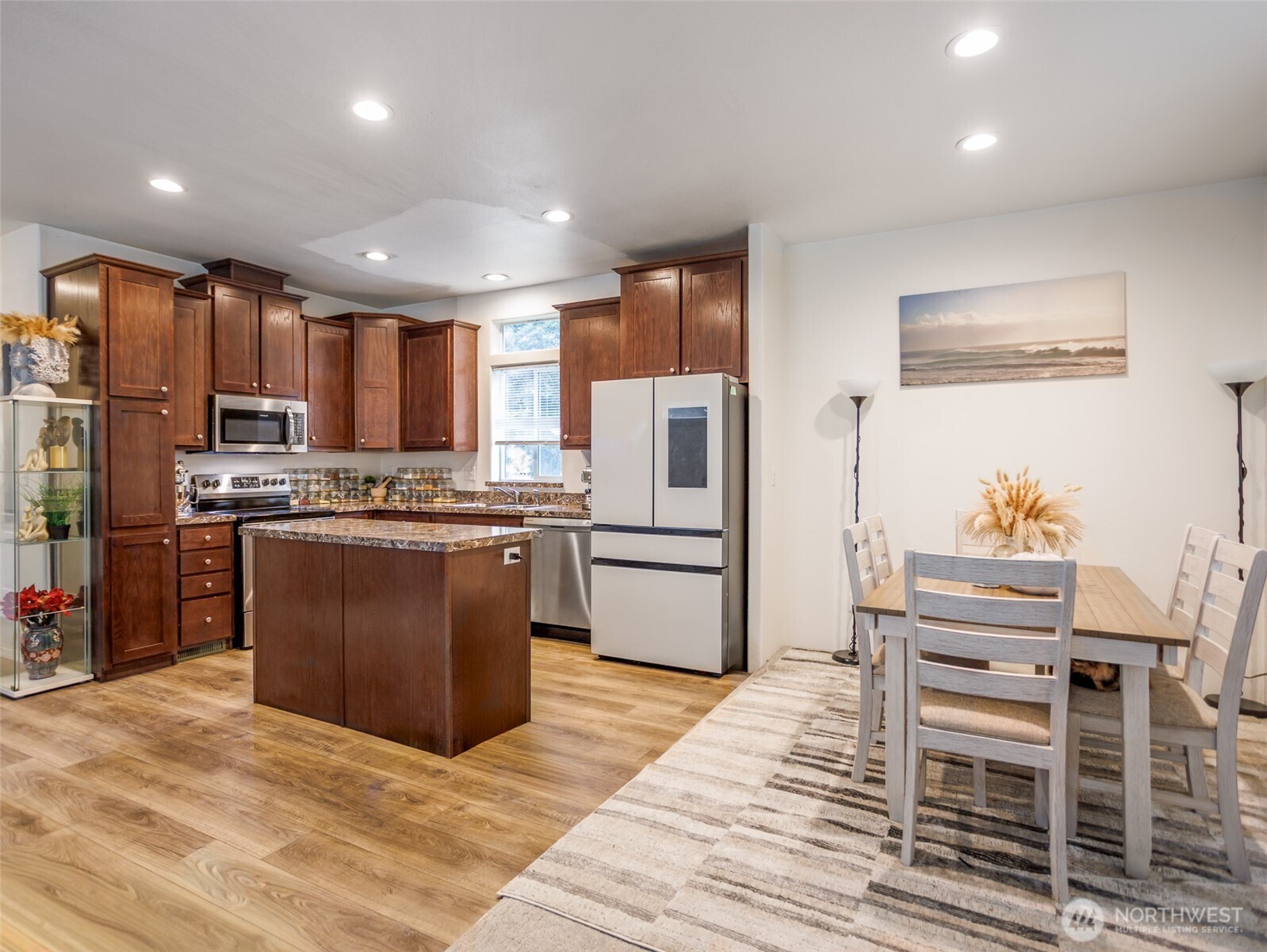 9430 Case Road Southwest, Unit 29 Olympia, WA 98512 - Photo 9 of 22 a kitchen with stainless steel appliances kitchen island granite countertop a refrigerator stove and oven