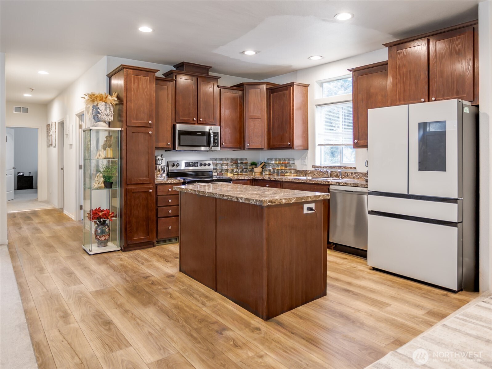 9430 Case Road Southwest, Unit 29 Olympia, WA 98512 - Photo 10 of 22 a kitchen with stainless steel appliances granite countertop a refrigerator a stove a sink and a microwave