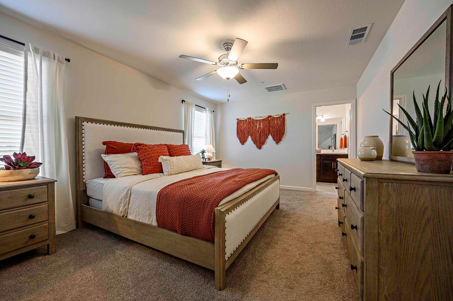 63 Blueberry Lane, Unit 5 Merced, CA 95341 - Photo 11 of 28 a bed room with a bed and a chandelier