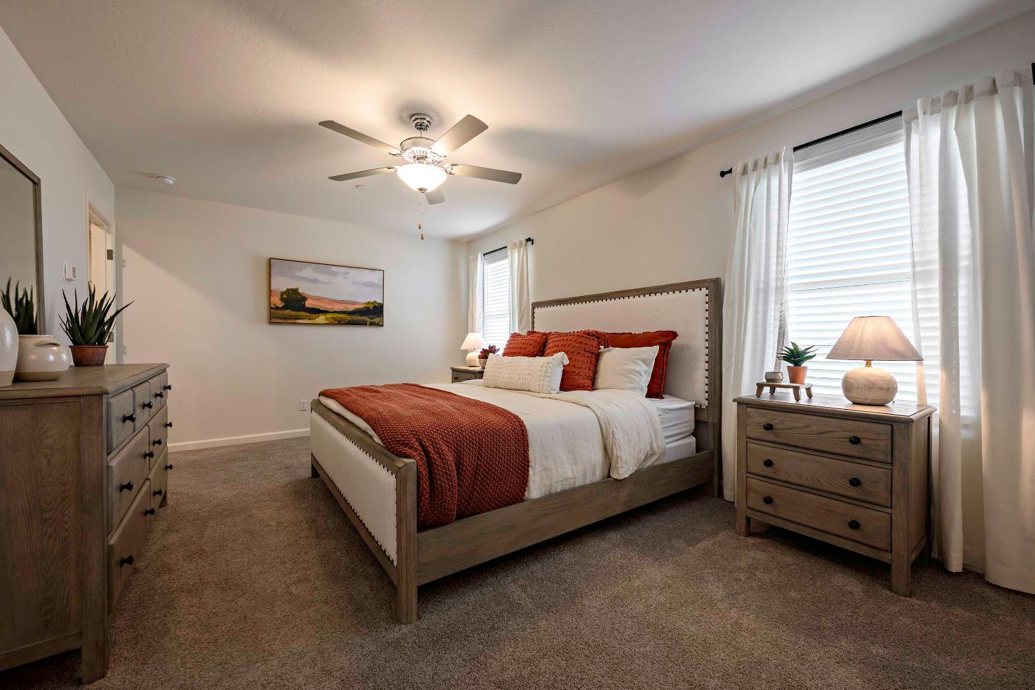 63 Blueberry Lane, Unit 5 Merced, CA 95341 - Photo 12 of 28 a bedroom with a bed and a chandelier