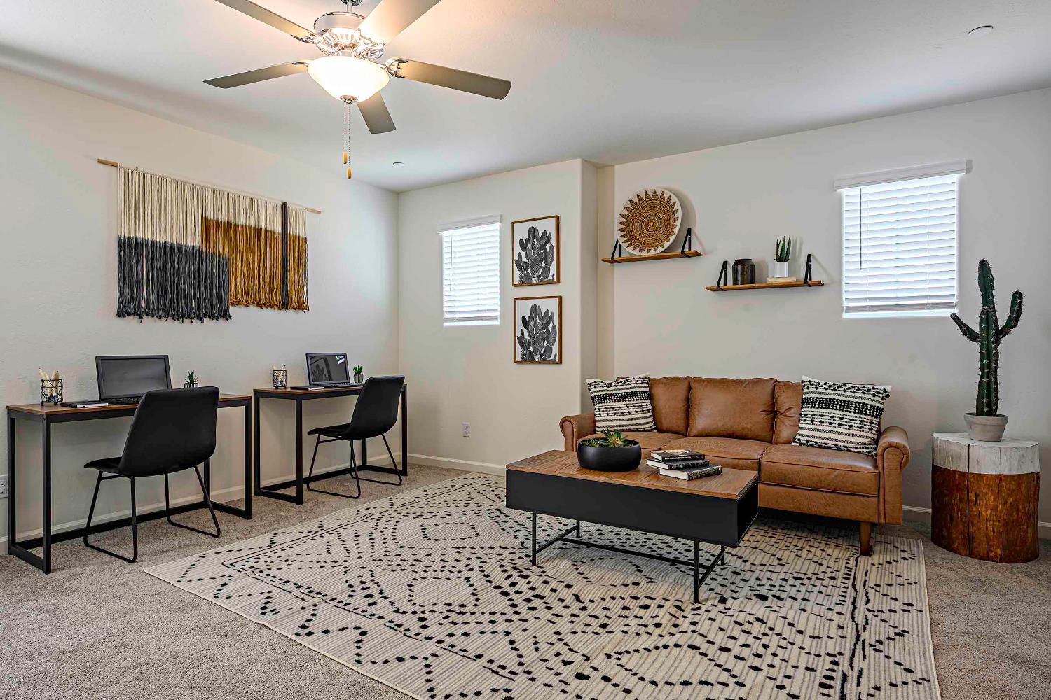 63 Blueberry Lane, Unit 5 Merced, CA 95341 - Photo 26 of 28 a living room with furniture a flat screen tv and a window