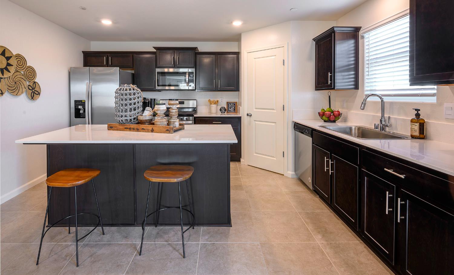 63 Blueberry Lane, Unit 5 Merced, CA 95341 - Photo 3 of 28 a kitchen with stainless steel appliances granite countertop a sink stove and refrigerator