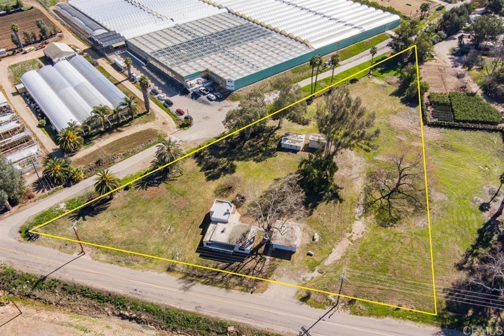 2061 Sycamore Drive San Marcos, CA 92069 - Photo 1 of 27 an aerial view of a house with a yard