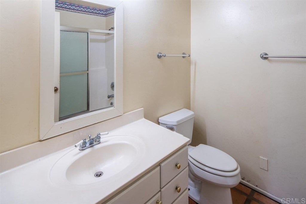 2061 Sycamore Drive San Marcos, CA 92069 - Photo 14 of 27 a bathroom with a sink toilet and mirror