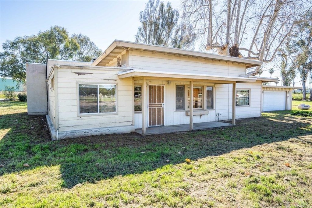2061 Sycamore Drive San Marcos, CA 92069 - Photo 3 of 27 a view of a house with backyard and garden