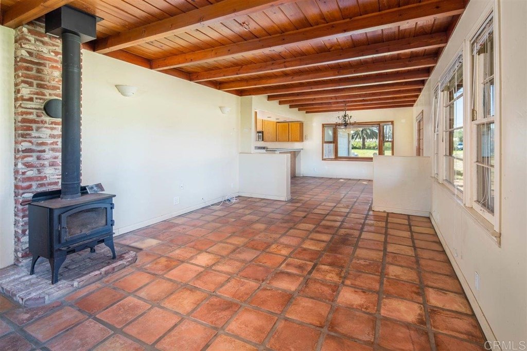 2061 Sycamore Drive San Marcos, CA 92069 - Photo 6 of 27 a bedroom with a bed and wooden floor