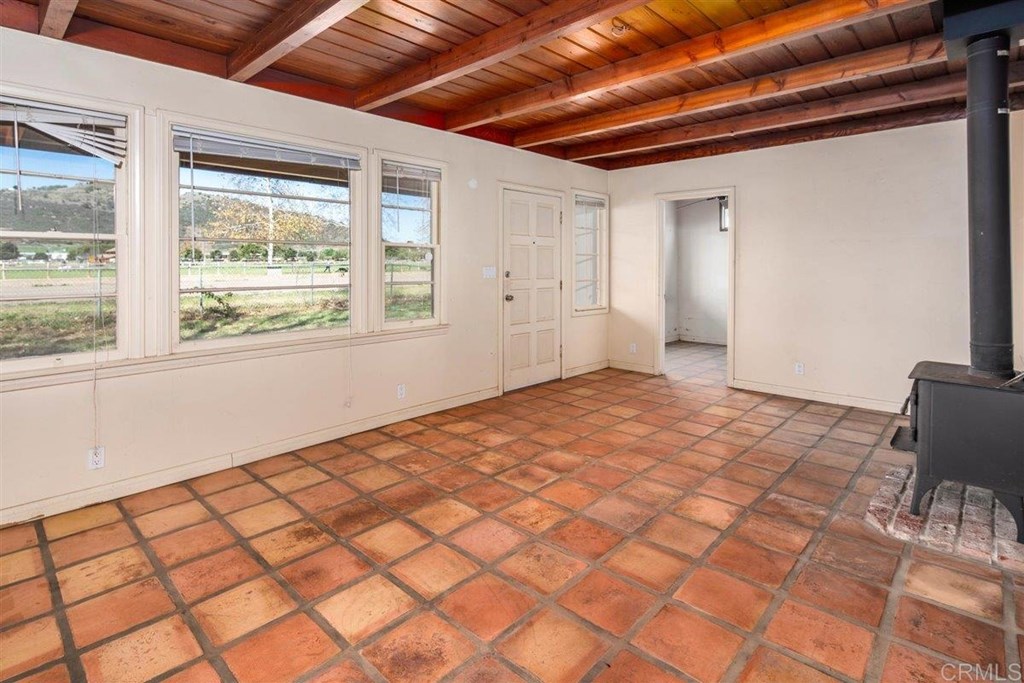 2061 Sycamore Drive San Marcos, CA 92069 - Photo 7 of 27 a view of an empty room and a window
