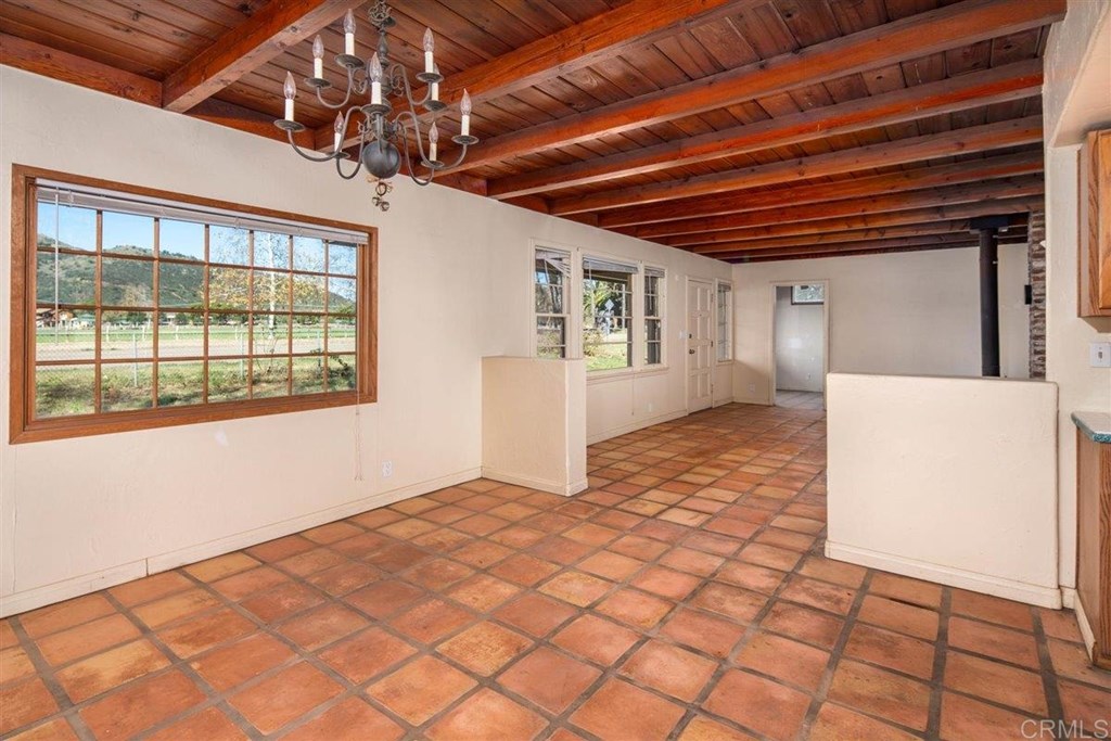 2061 Sycamore Drive San Marcos, CA 92069 - Photo 8 of 27 a view of an empty room with a window