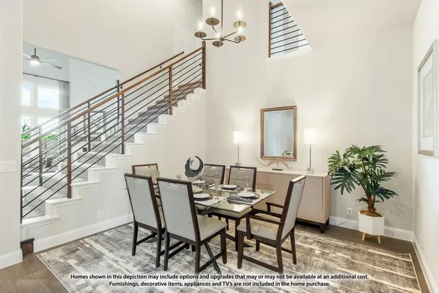a view of a dining room with furniture and a rug