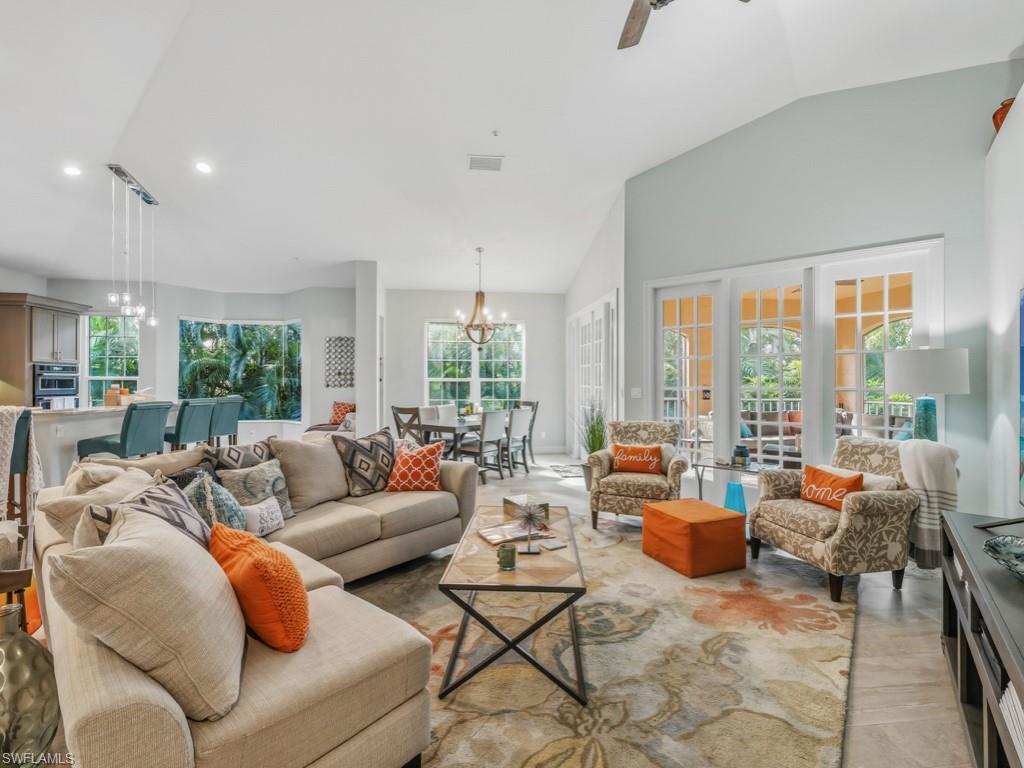 175 Colonade Circle Naples, FL 34103 - Photo 16 of 45 a living room with furniture and a large window