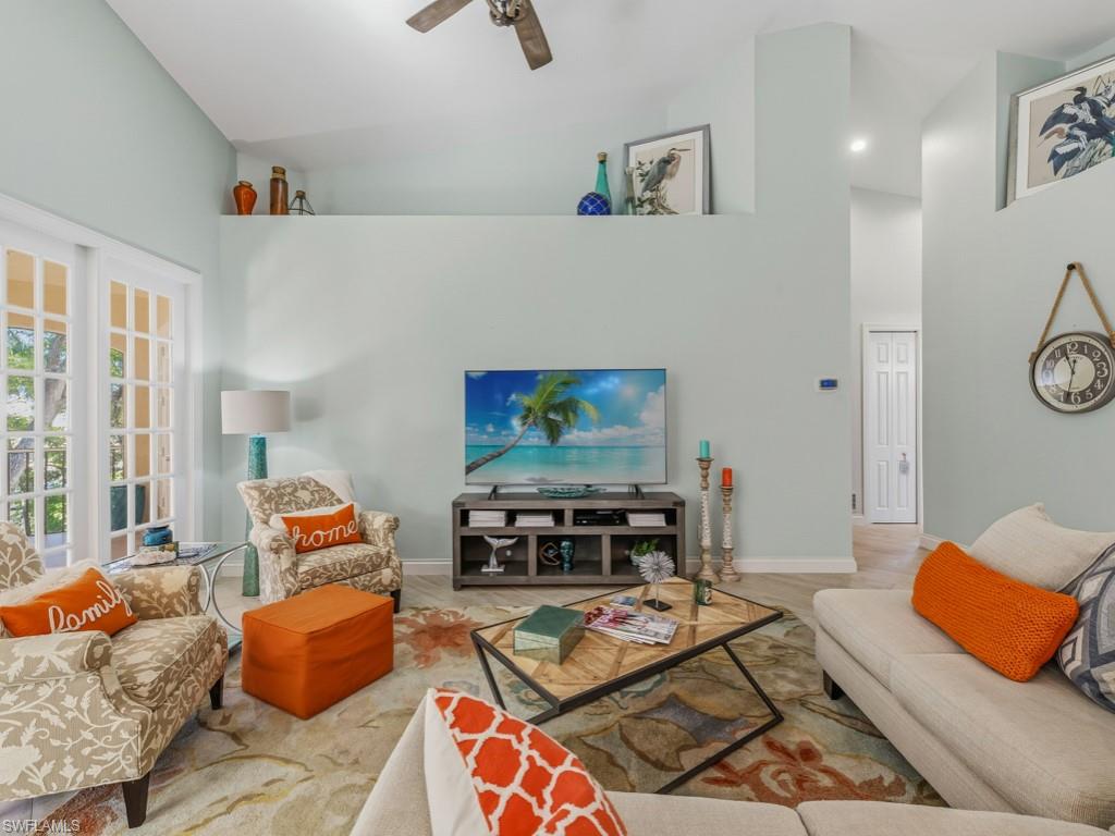 175 Colonade Circle Naples, FL 34103 - Photo 19 of 45 a living room with furniture and a couch